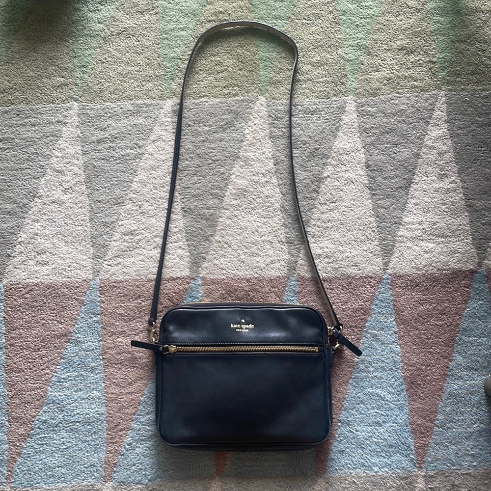 Black Kate Spade crossbody. Padded sides for use with an iPad.